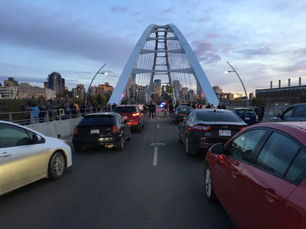 Activists with the Extinction Rebellion movement blocking the Walterdale Bridge into downtown Edmonton Monday morning as part of international protests demanding new climate policies. Monday, October 7, 2019.