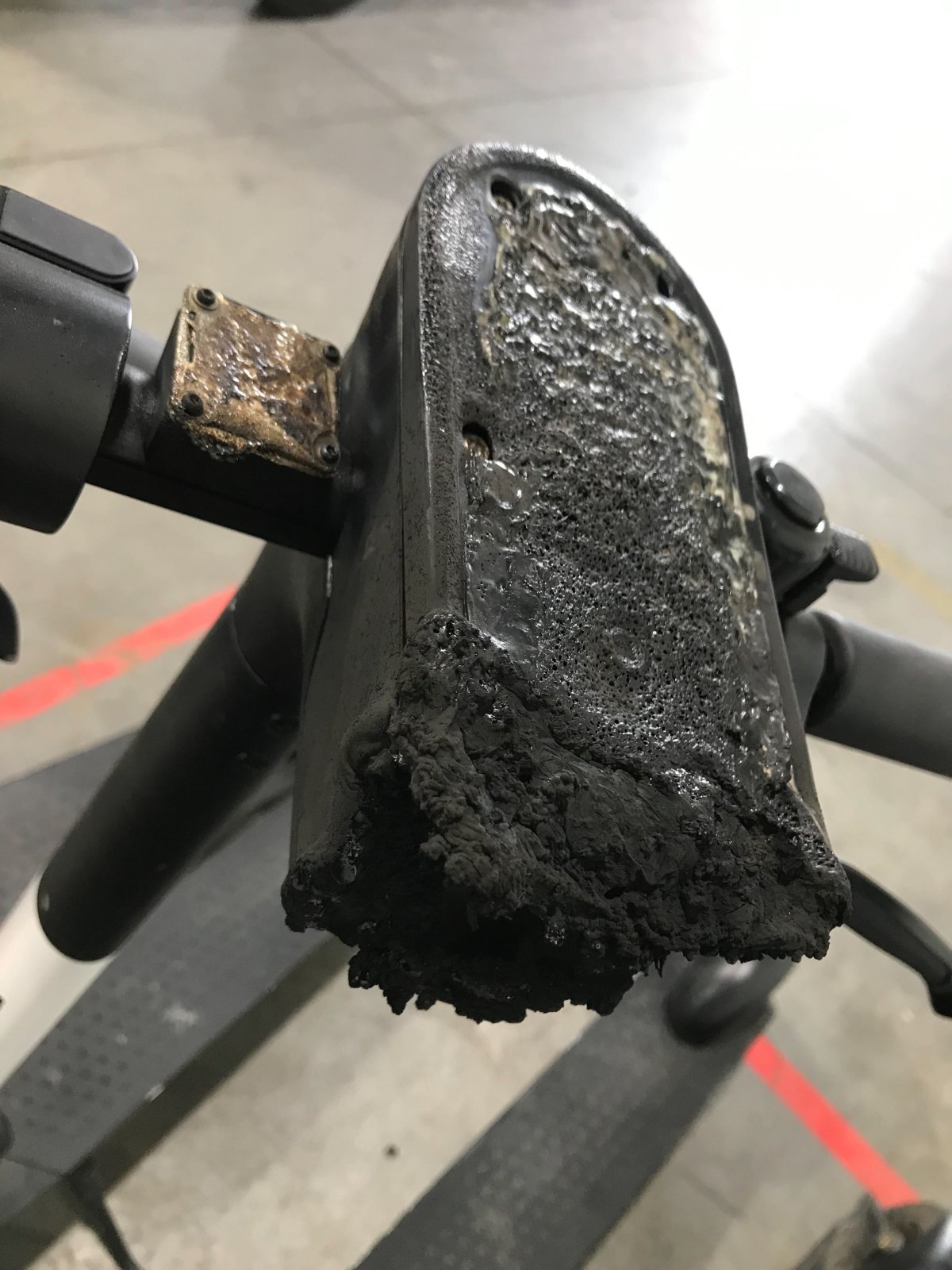 A photo of a burned Bird e-scooter console.