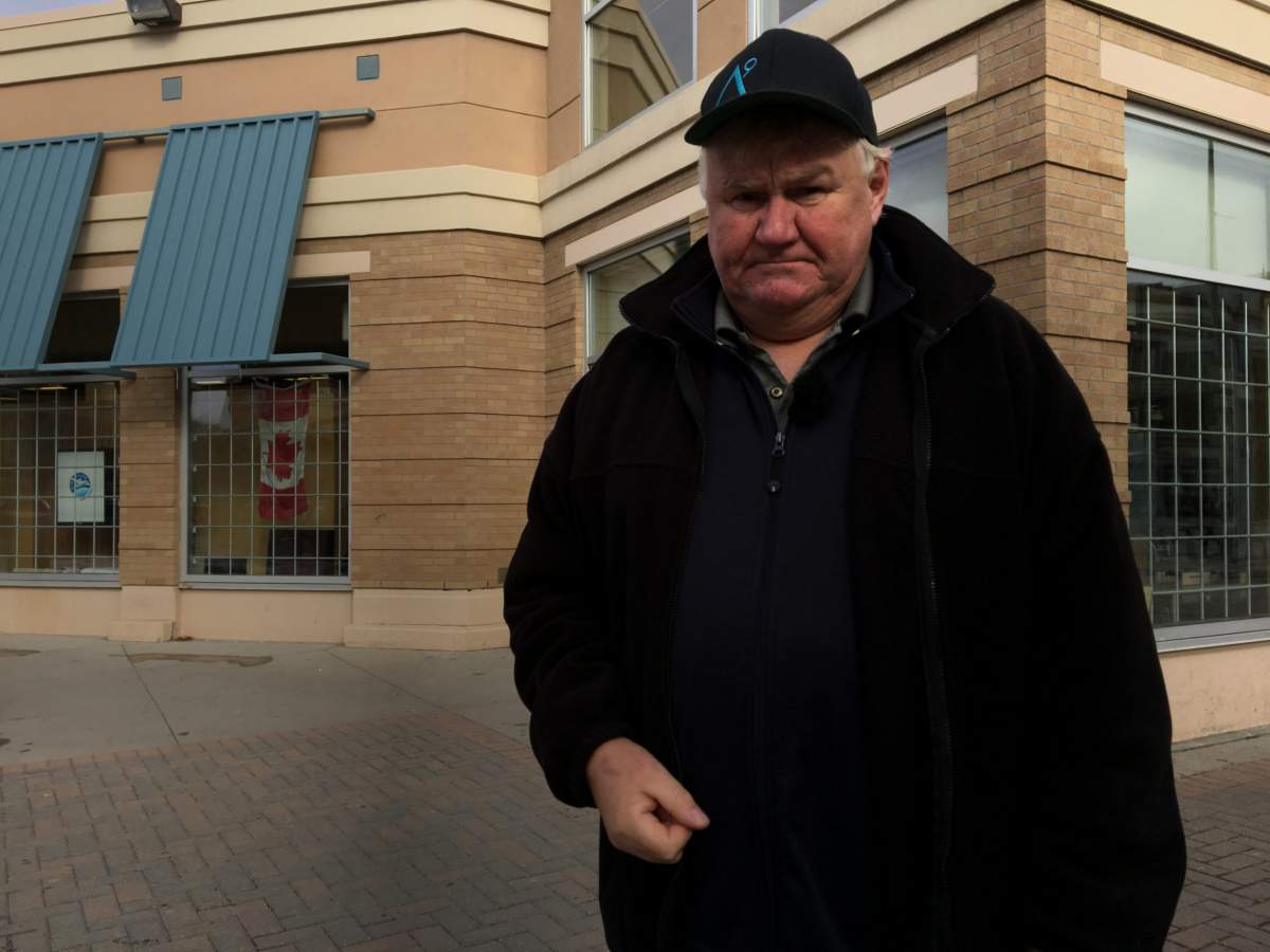 Michael standing outside of the Osborne Street Liquor Mart where he was injured.