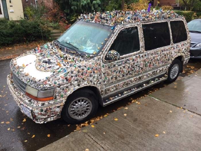 Albino Carreira’s minivan covered in plastic bugs.