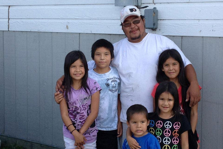 Tyson McKay, of the northern Manitoba indigenous community of Cross Lake, poses with his nieces and nephews in the fall of 2014. McKay died from a heart attack in 2015, shortly after visiting the remote reserve's federal government clinic. 