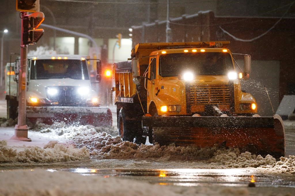 Crews seen cleaning up following a winter storm in this 2019 file photo. THE CANADIAN PRESS/John Woods.