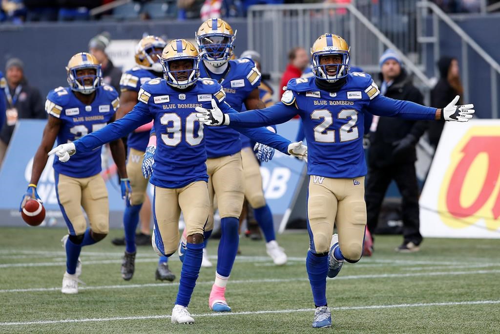 Winnipeg Blue Bombers’ Winston Rose (30) and Chandler Fenner (22) celebrate Fenner’s interception during the second half of CFL action against the Montreal Alouettes, in Winnipeg, Saturday, Oct. 12, 2019. THE CANADIAN PRESS/John Woods