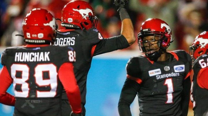 Calgary Stampeders' Hergy Mayala, right, celebrates his touchdown with teammates during second half CFL football action against the Saskatchewan Roughriders in Calgary, Friday, Oct. 11, 2019.THE CANADIAN PRESS/Jeff McIntosh.