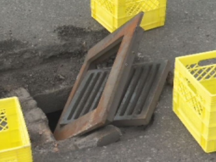 Lorinda and Lorne Pearson of Grand Forks say this loose grate at a McDonald’s parking lot in Kelowna damaged their truck.