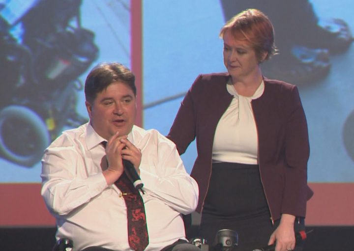 Kent Hehr and his wife, Deanna Holt, appear onstage at his concession speech in Calgary on Oct. 21, 2019.