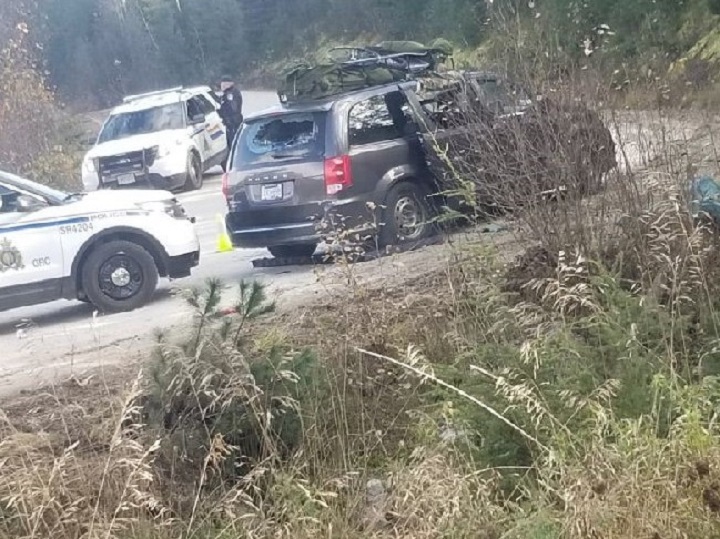 Police vehicles surround a van with broken windows on Sederberg Road off Highway 1 in Malakwa.