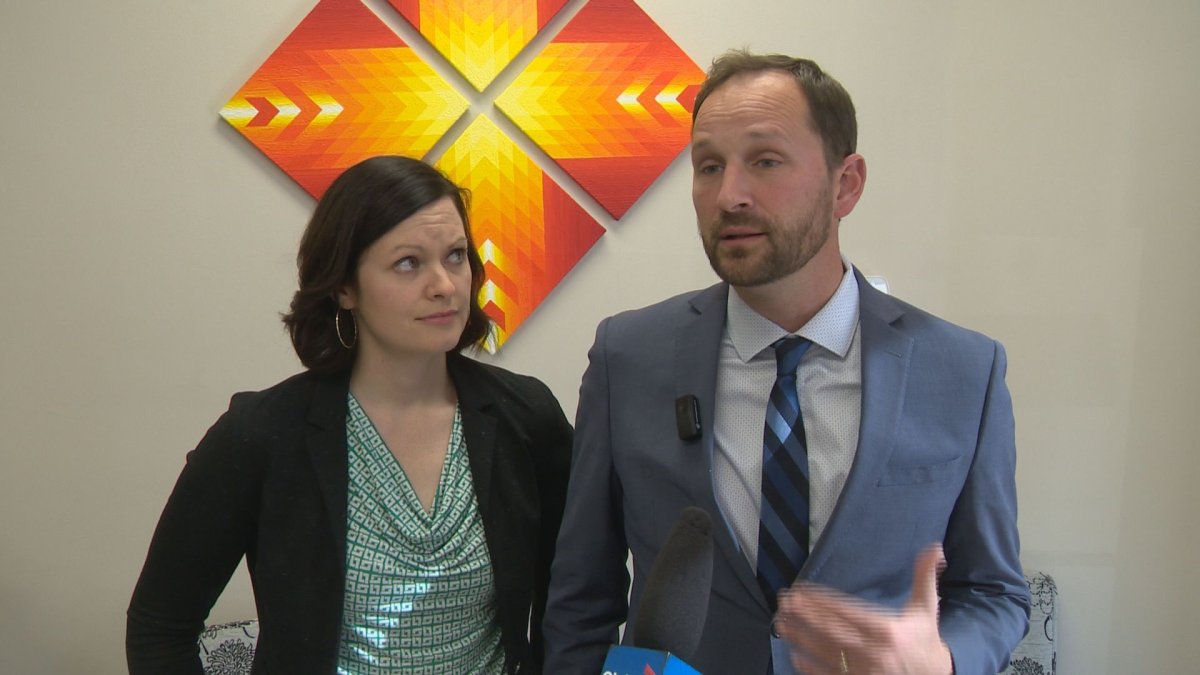 Saskatchewan NDP health critic Vicki Mowat looks on as party leader Ryan Meili speaks about the party's new health survey.