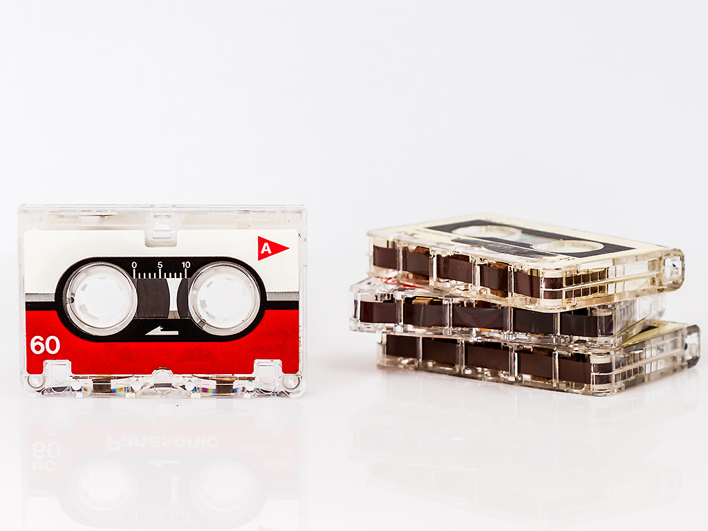 A few old micro audiotapes, isolated on white background.