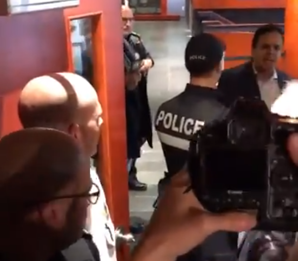 Abdelhaq Sari, at the far right, was denied entry to a press conference held by Montreal police.