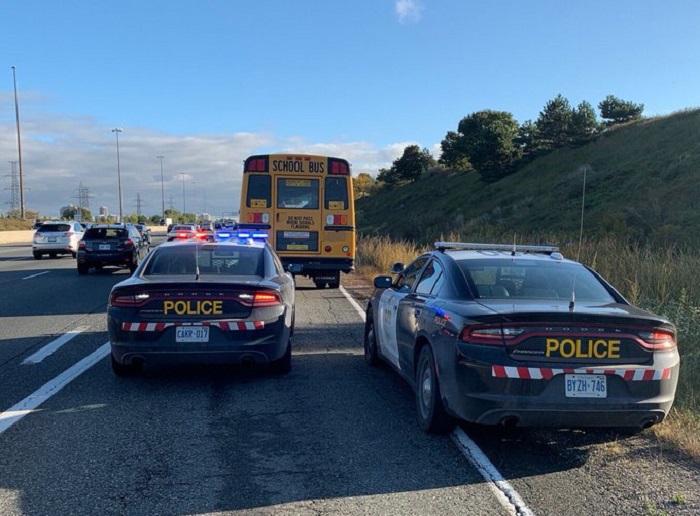 A witness called 911 after seeing the school bus moving "all over the road" while driving eastbound on Highway 403 in Mississauga.