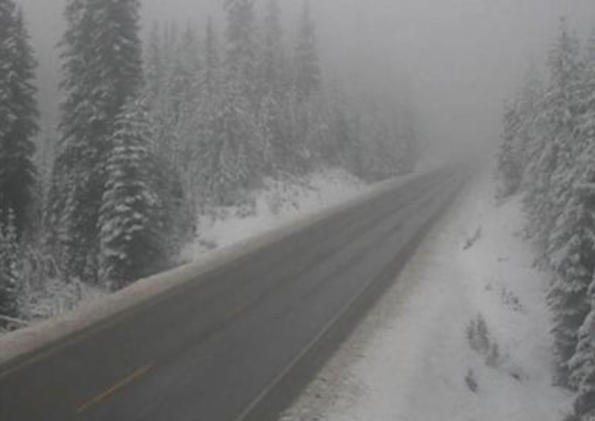 Road conditions along the Paulson Summit on Monday afternoon. Environment Canada has issued a snowfall warning for sections of Highway 3.