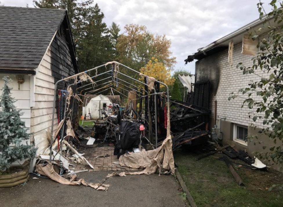 London fire crews battled a fire at a pool shed and two neighbouring homes on Friday morning.