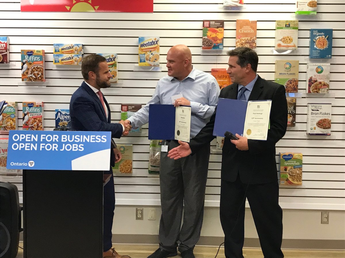 Peterborough-Northumberland MPP David Piccini, left, announces $412,700 in funding for Post Consumer Brands facilities in Cobourg on Tuesday.