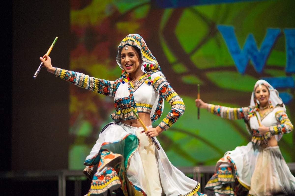 GSBC board member Priyanka Patel is shown here wearing traditional Gujarati clothing, and performing Gujarati folk dances.