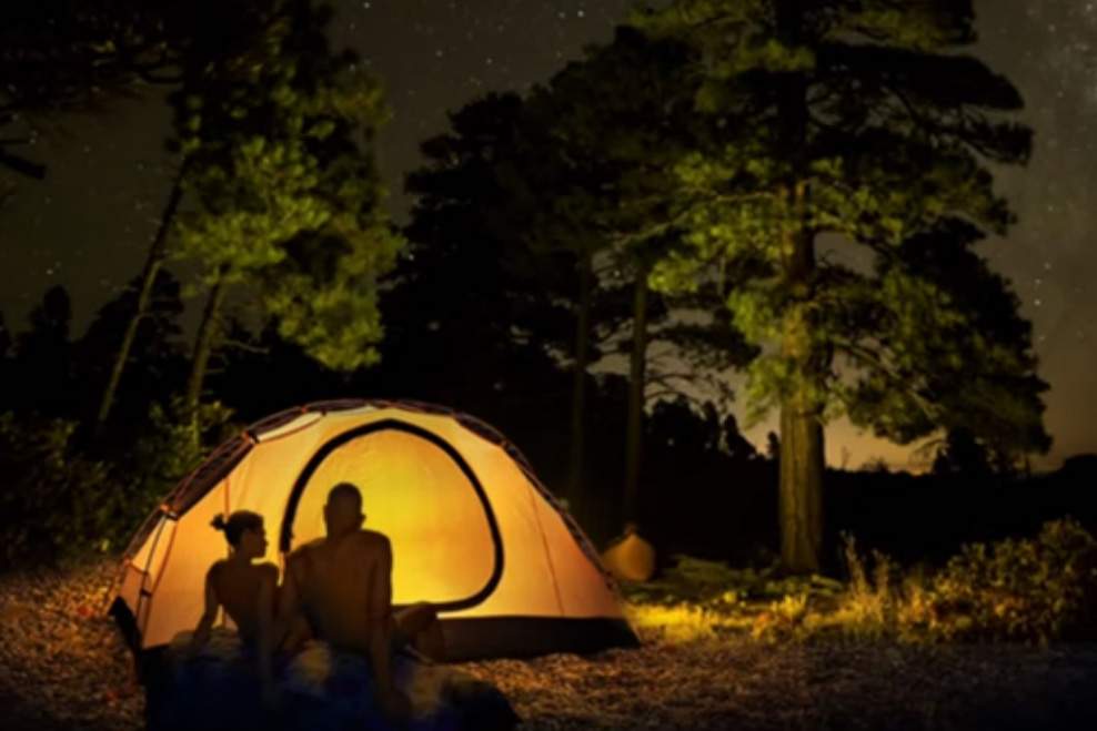 Two campers are shown in this promotional image for Rock Haven Lodge Family Nudist Park in Murfreesboro, Ten.