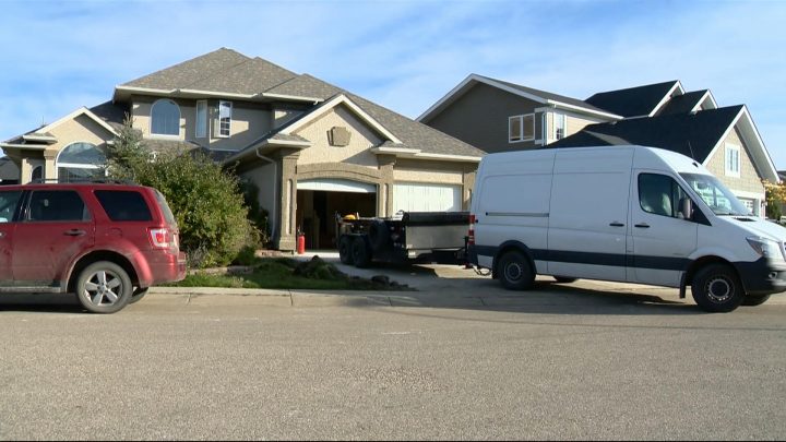 Crews could be seen removing items from a home in Briarwood, which is slated for demolition by the City of Saskatoon.
