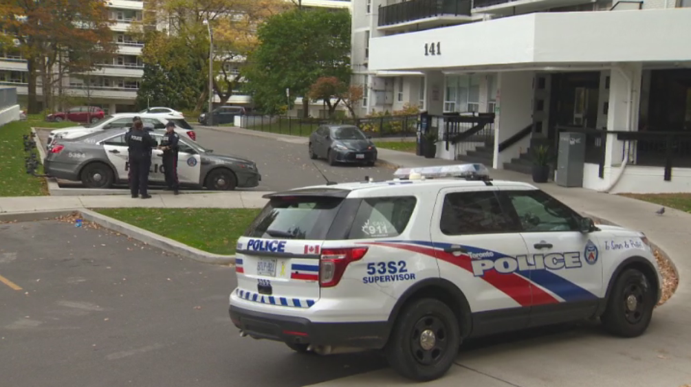 Police outside of a residential building in midtown Toronto Saturday investigating an incident that left two people critically injured.