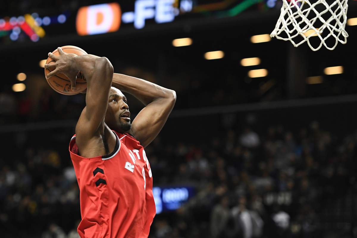 Toronto Raptors forward Serge Ibaka (9) attempts a basket during the second quarter of a preseason NBA basketball game against the Brooklyn Nets, Friday, Oct. 18, 2019, in New York.
