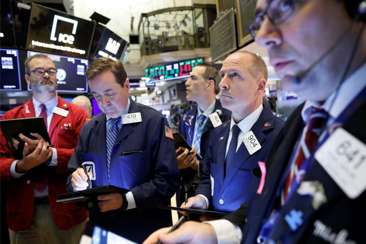 Traders work on the floor at the New York Stock Exchange (NYSE) in New York, U.S., October 28, 2019. 