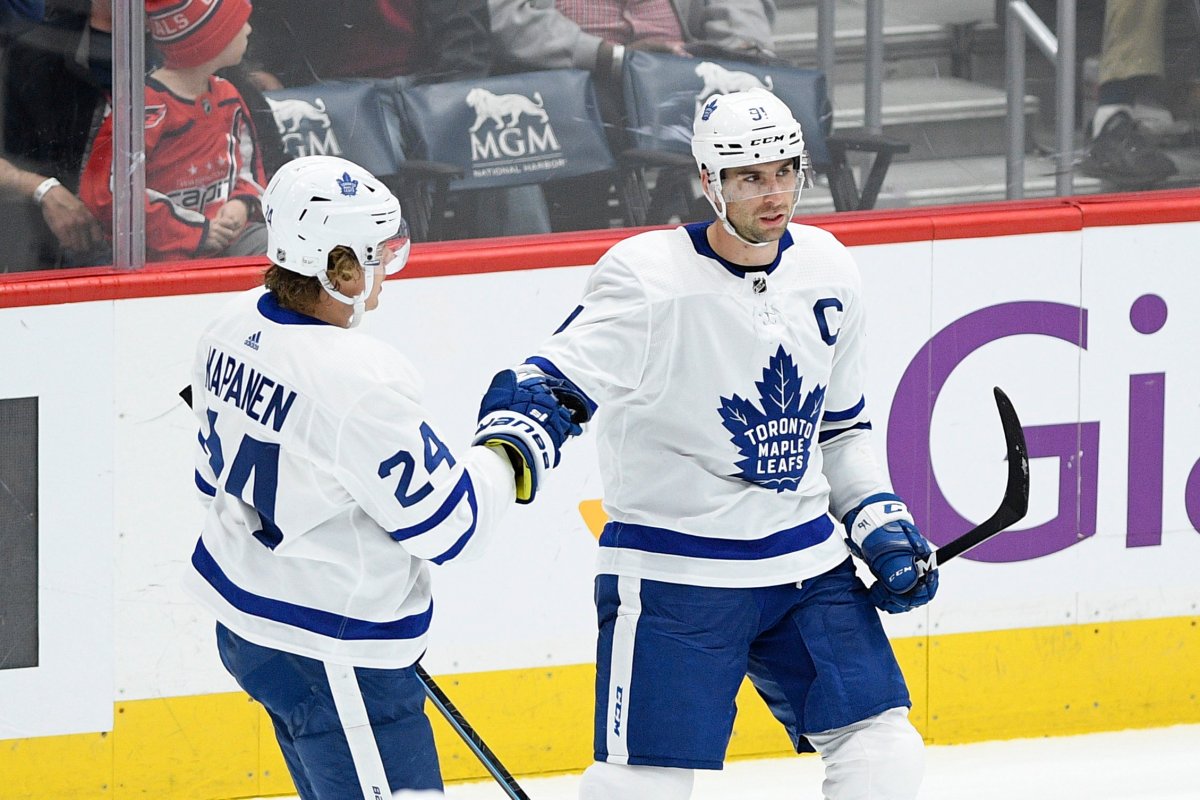 Toronto Maple Leafs center John Tavares, right, celebrates his goal with right wing Kasperi Kapanen (24), of Finland, during the third period of the team's NHL hockey game against the Washington Capitals, Wednesday, Oct. 16, 2019, in Washington. The Capitals won 4-3.