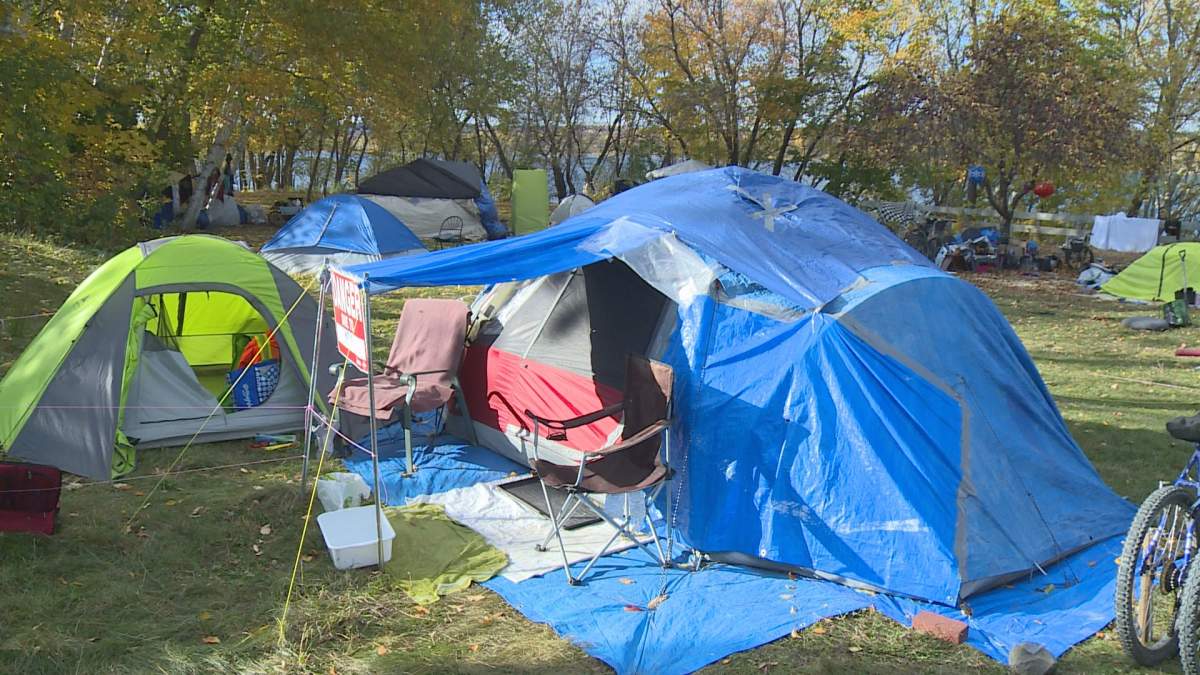 Fredericton’s tent city is located behind Government House on the banks of the Saint John River.