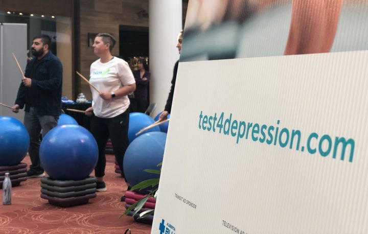 Patrons at The Core in downtown Calgary take part in a stress relieving drumming class. The YMCA-run class is one of the events the shopping mall has offered as part of  Mental Illness Awareness Week.