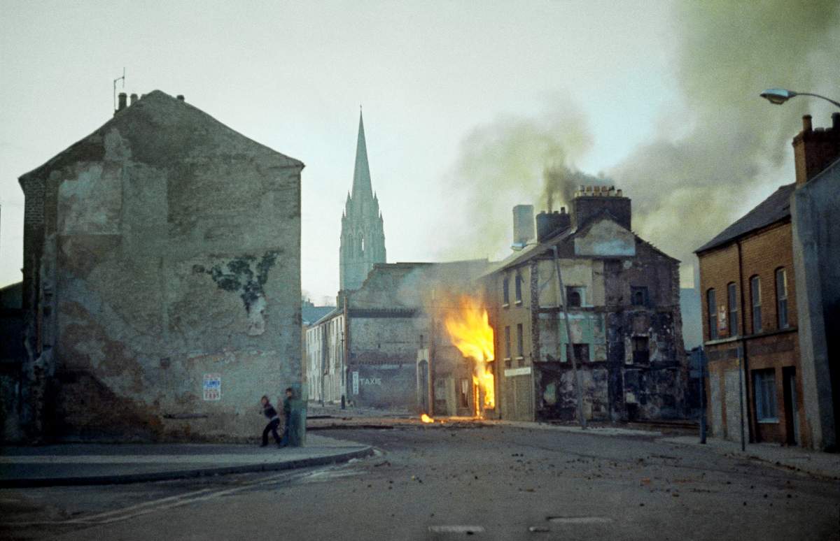 In this February 1972 file photo, a building burns in the bogside district of Londonderry, Northern Ireland, in the aftermath of Bloody Sunday, one of the most notorious events of “The Troubles.”