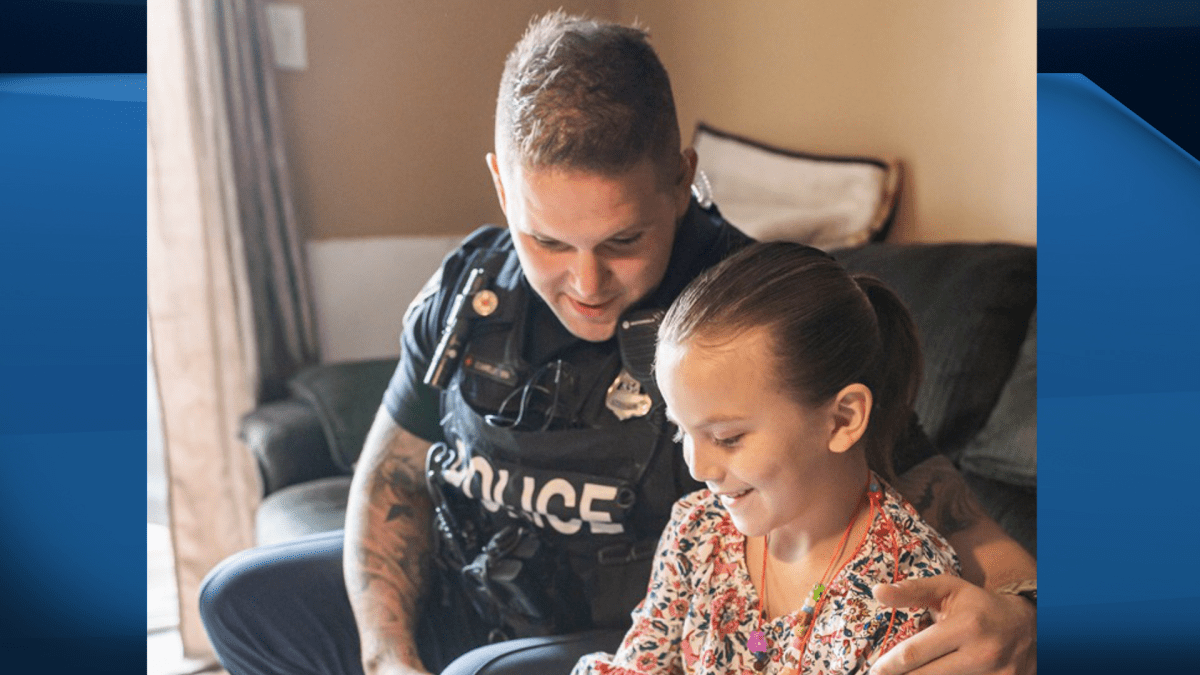Tiannah Antone-Federici, 7, meets with Hamilton police Const. Sean Connelly, who's been credit with saving the young girls life after she went into cardiac arrest.