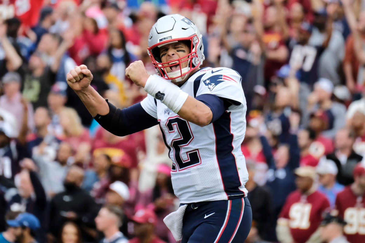 New England Patriots quarterback Tom Brady (12) reacts to a touchdown against the Washington Redskins during the second half of an NFL football game, Sunday, Oct. 6, 2019, in Washington.