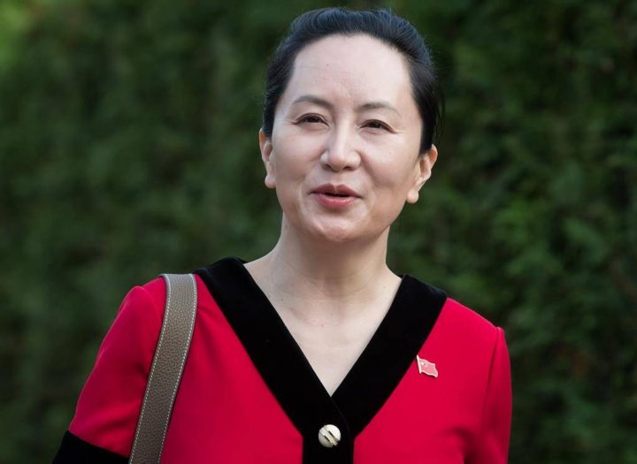 Huawei chief financial officer Meng Wanzhou, who is out on bail and remains under partial house arrest after she was detained last year at the behest of American authorities, wears a Chinese flag pin on her dress as she leaves her home to attend a court hearing in Vancouver, on Tuesday October 1, 2019.
