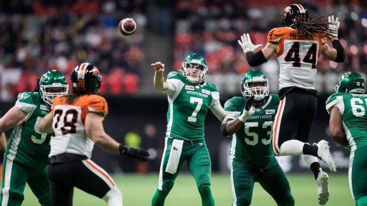 Saskatchewan Roughriders quarterback Cody Fajardo (7) passes as Philip Blake (53) watches B.C. Lions' Isaiah Guzylak-Messam (44) during the second half of a CFL football game in Vancouver, on Friday October 18, 2019.