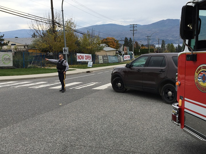 A police car and fire truck can be seen at Gellatly Road and Carrington Road in West Kelowna.