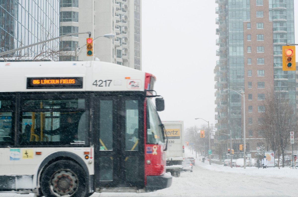 An OC Transpo bus is pictured during a snowstorm in Ottawa on February 2, 2011.