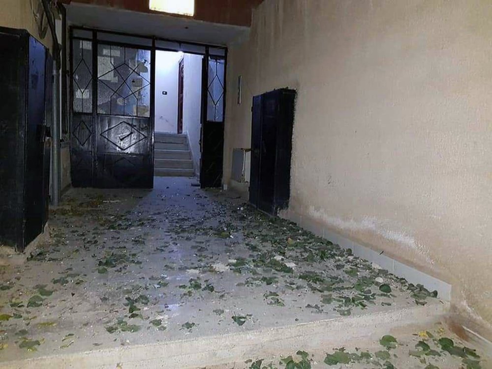 In this photo released by the Syrian official news agency SANA, a damaged building targeted by Israeli missile strikes is seen in the Qudsaya suburb, west of the capital Damascus, Syria, Wednesday, Nov. 20, 2019. The Israeli military on Wednesday said it struck dozens of Iranian targets in Syria, carrying out a "wide-scale" strike in response to rocket fire on the Israeli-controlled Golan Heights the day before. 