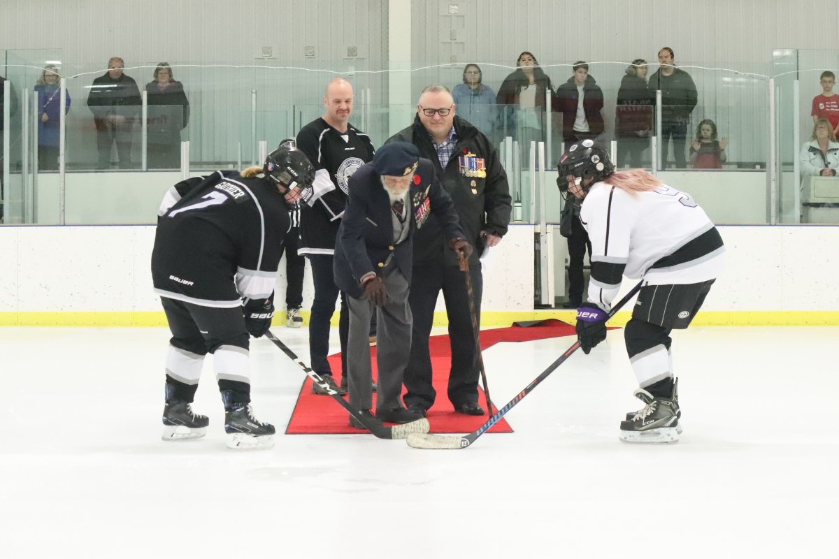 John Kozoriz, a veteran of the Second World War , drops the puck at his great-granddaughter's hockey game in Edmonton, Alta., on Nov. 11, 2019.