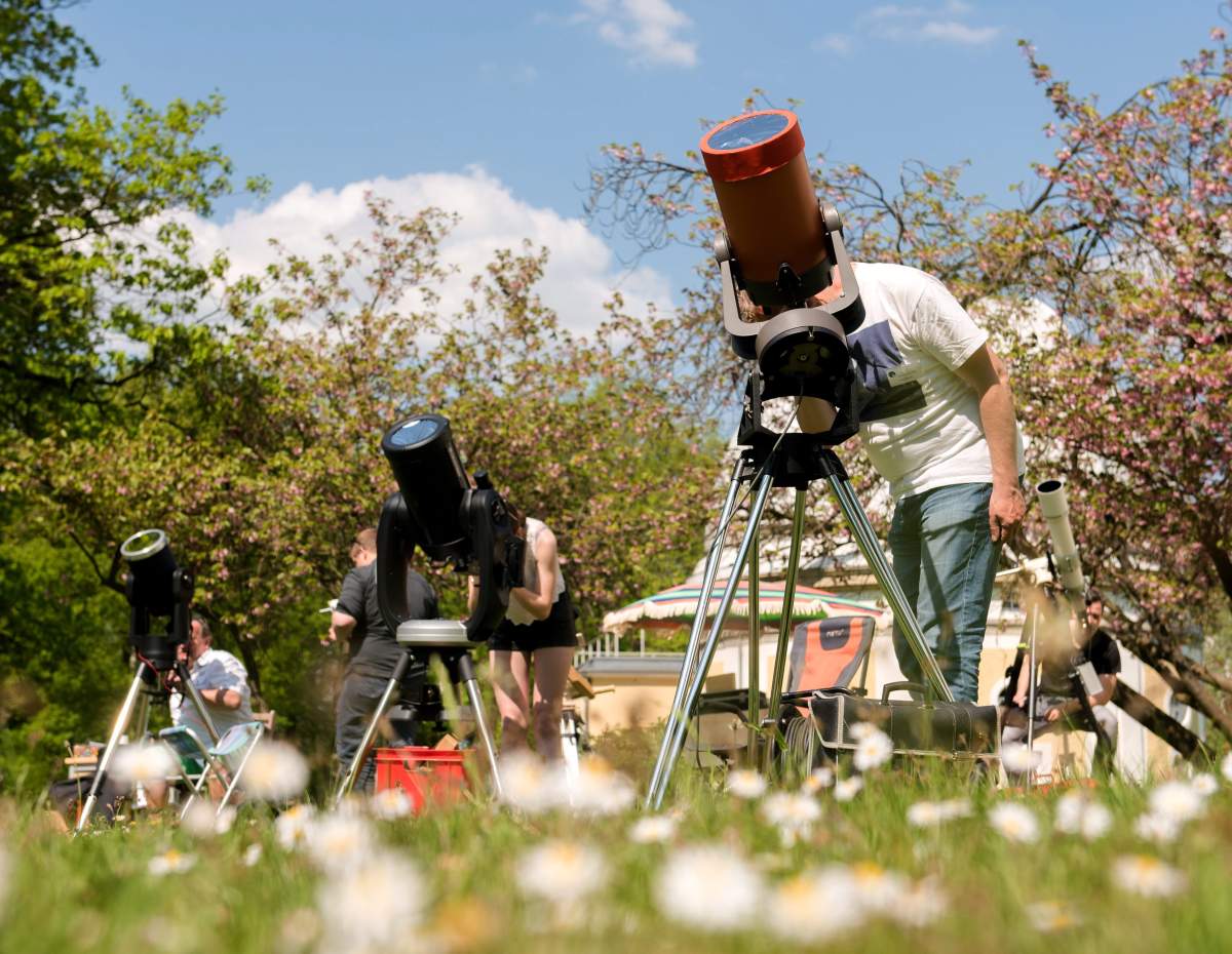 Amateur astronomers use their telescopes to watch planet Mercury passing in front of the sun, on the grounds of the Bergedorf observatory, in Hamburg, Germany, 9 March 9, 2016.