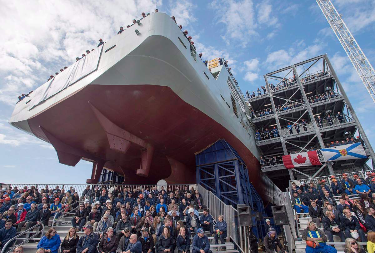 Shipyard workers attend the naming ceremony for Canada's lead Arctic and Offshore Patrol Ship, the future HMCS Harry DeWolf, in Halifax on Friday, Oct. 5, 2018.