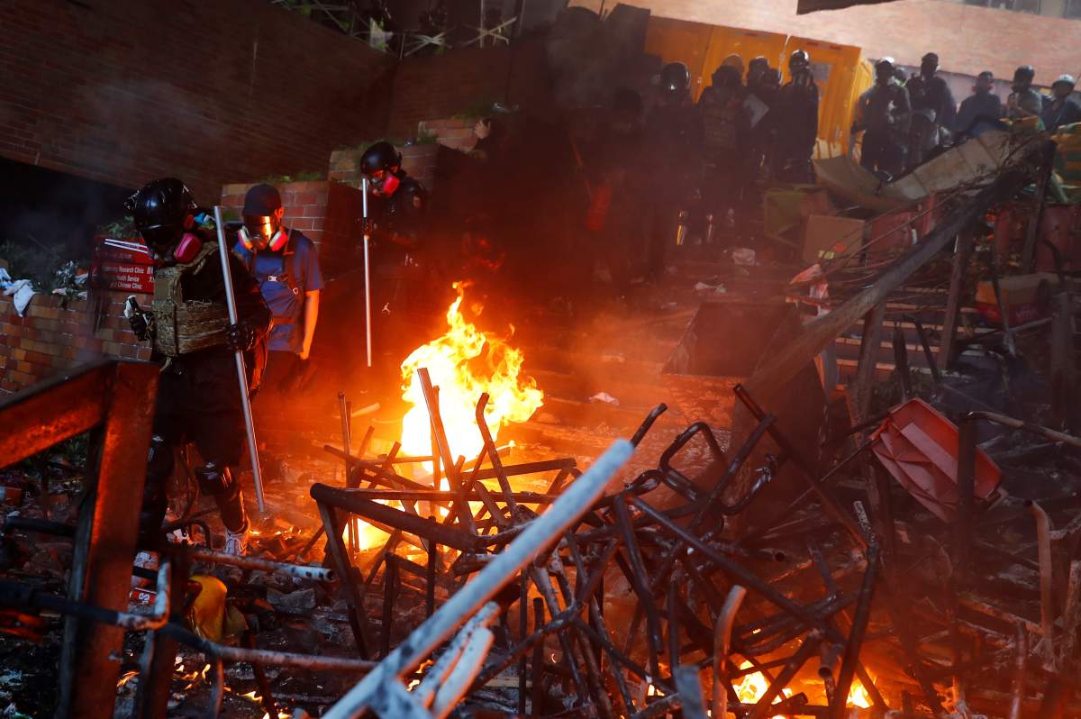 Protesters attempt to leave the campus of Hong Kong Polytechnic University during clashes with police in Hong Kong, China on Nov. 18, 2019. (REUTERS/Thomas Peter)