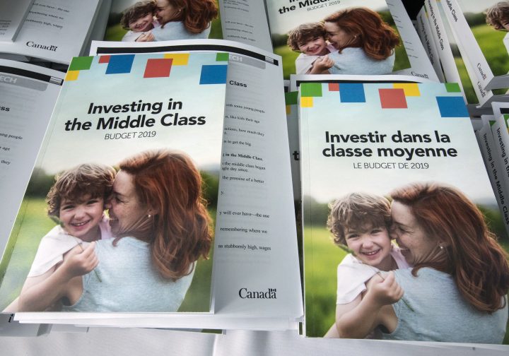 Copies of the 2019 budget booklet are stacked at a lockup session with experts and reporters in Ottawa on Tuesday, March 19, 2019. 