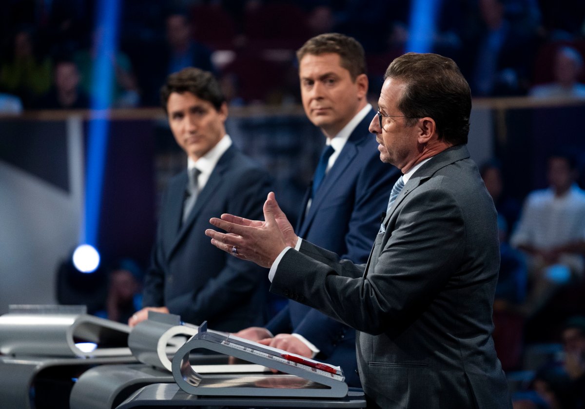 Liberal leader Justin Trudeau, left to right, Conservative leader Andrew Scheer and Bloc Quebecois leader Yves-Francois Blanchet take part in the the Federal leaders French language debate in Gatineau, Que. on Thursday, October 10, 2019. 
