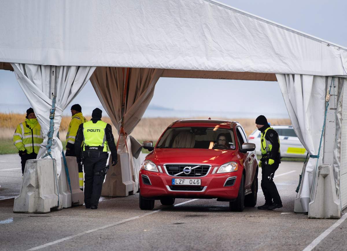 Danish police check travellers from Sweden, near the Highway coming out of the Tunnel near Copenhagen, Denmark, Tuesday Nov. 12, 2019. (Liselotte Sabroe/Ritzau Scanpix via AP)