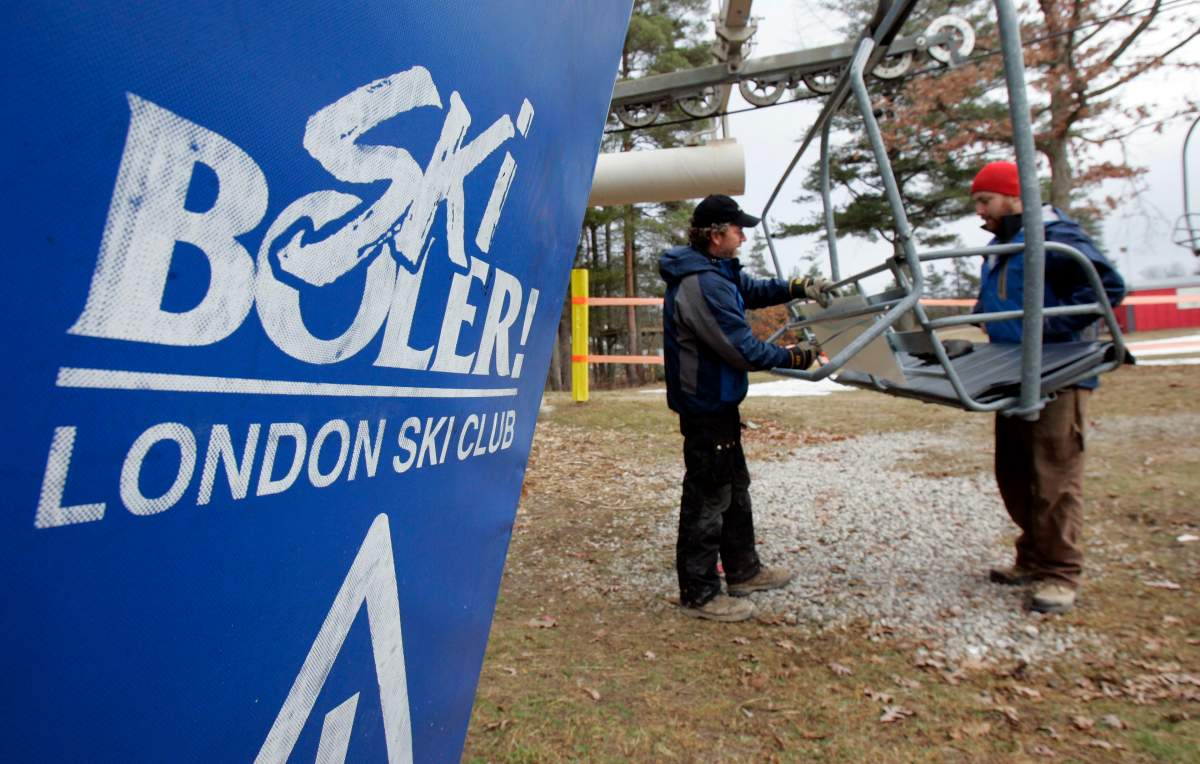 Signs are added to the chair lift on Boler Mountain in London, Ontario, Friday, Dec. 29, 2006. 