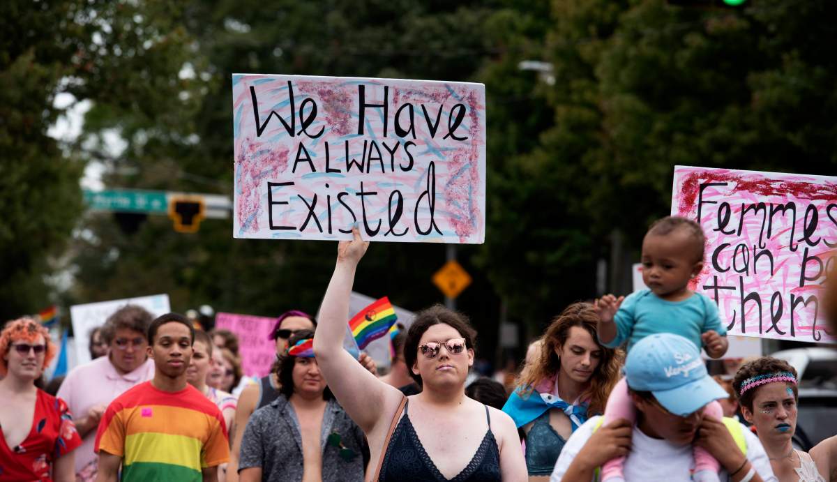 Transgender and non-binary individuals and their allies stroll through the city's Midtown district during Gay Pride's Transgender Rights march in Atlanta on Saturday, Oct. 12, 2019. (AP Photo/Robin Rayne).