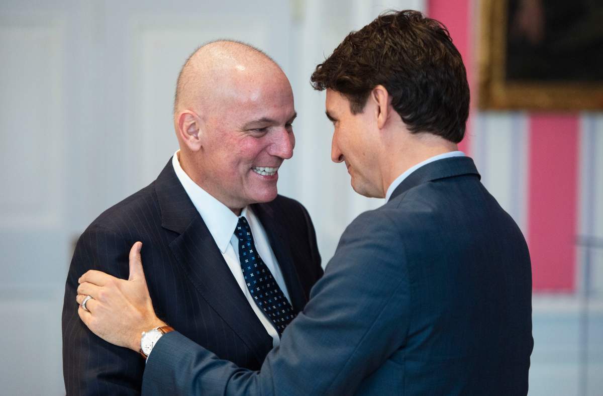 Prime Minister Justin Trudeau embraces Dominic LeBlanc as he’s sworn in as President of the Queen’s Privy Council for Canada during the swearing in of the new cabinet at Rideau Hall in Ottawa on Wednesday, Nov. 20, 2019.