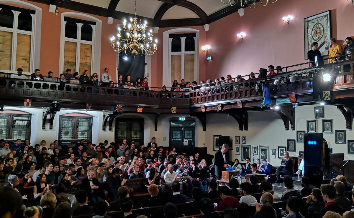 In this photo taken on Nov. 21, 2019, audience members look on during a debate on the threat of artificial intelligence at the Cambridge Union, the worlds oldest debating society, Cambridge, England.