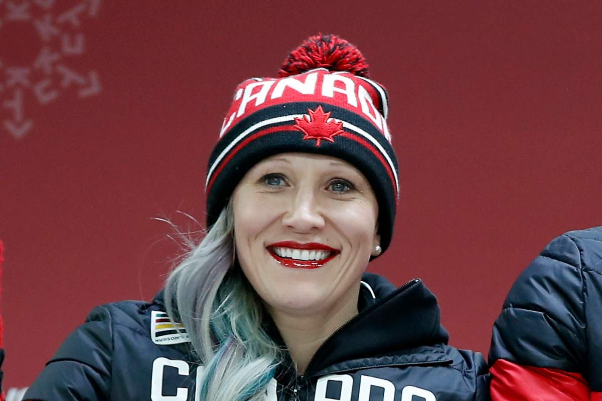 In this Feb. 21, 2018, file photo, Kaillie Humphries celebrates winning the bronze medal, with teammate Phylicia George (not shown), after the women's two-man bobsled final at the 2018 Winter Olympics in Pyeongchang, South Korea. 