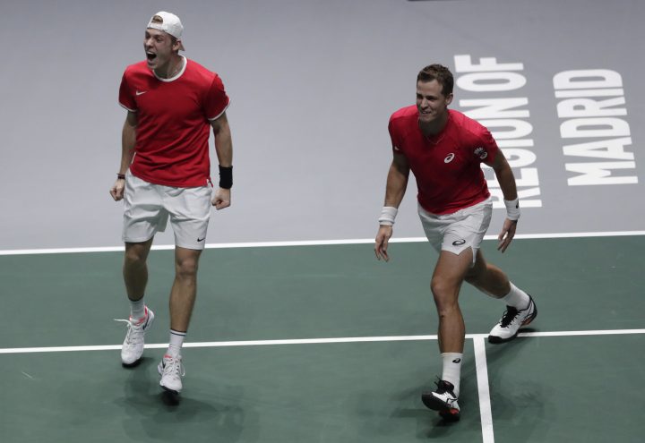 Canada's Denis Shapovalov, left, and his partner Vasek Pospisil celebrate after winning their Davis Cup semifinal doubles match against Russia's Karen Khachanov and Andrey Rublev, in Madrid, Spain, Saturday, Nov. 23, 2019. 