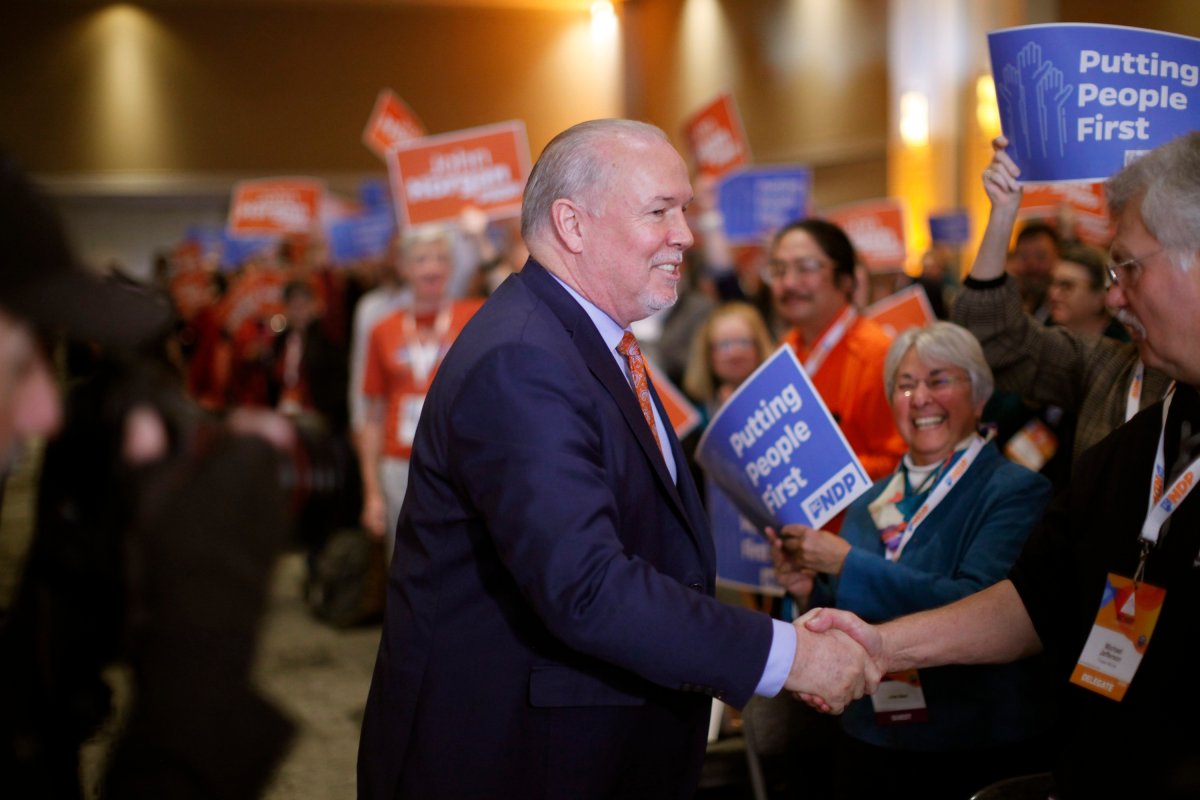 Premier John Horgan arrives to deliver his speech during the B.C. NDP Convention at the Victoria Convention Centre in Victoria, Saturday, Nov. 23, 2019.
