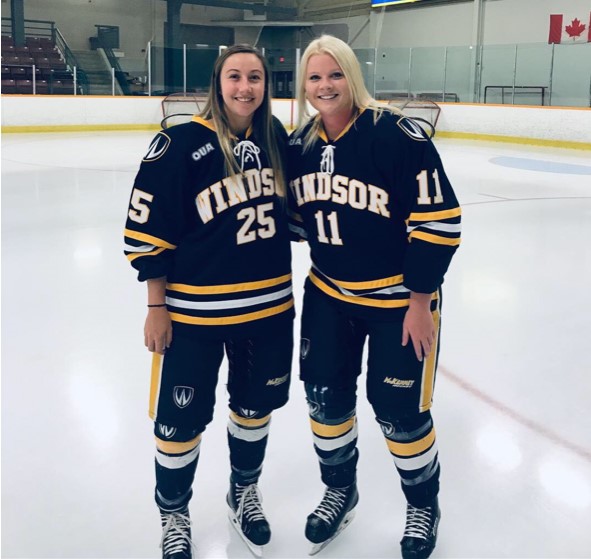 Reagan Kaufman (left) and Meredith Goldhawk (right), former University of Windsor hockey players, are pictured in a handout photo in 2019 at South Windsor Arena in Windsor, Ont.